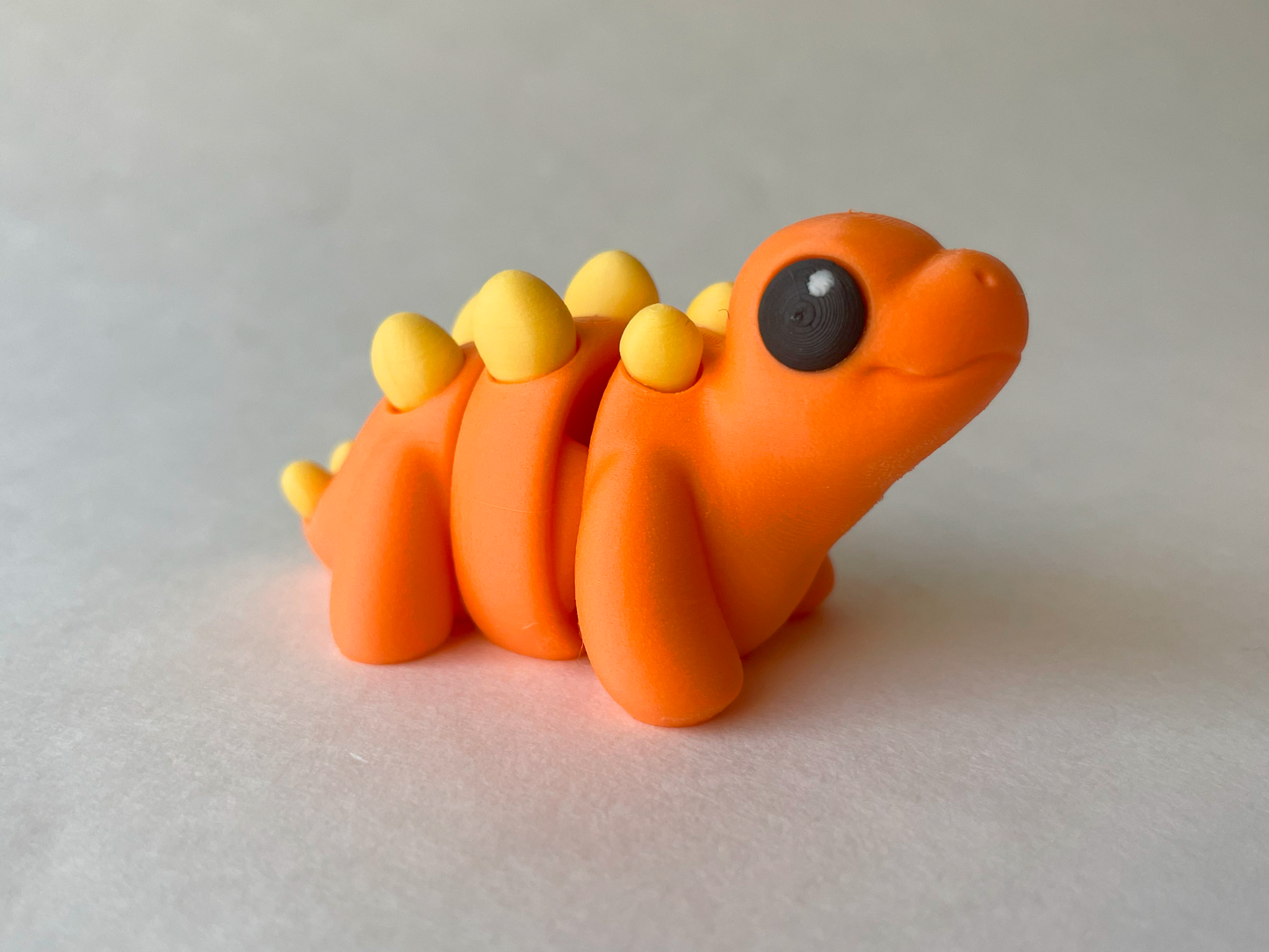 Orange Stegosaurus Dinosaur Flexi Toy Figurine for STEM Learning Play!