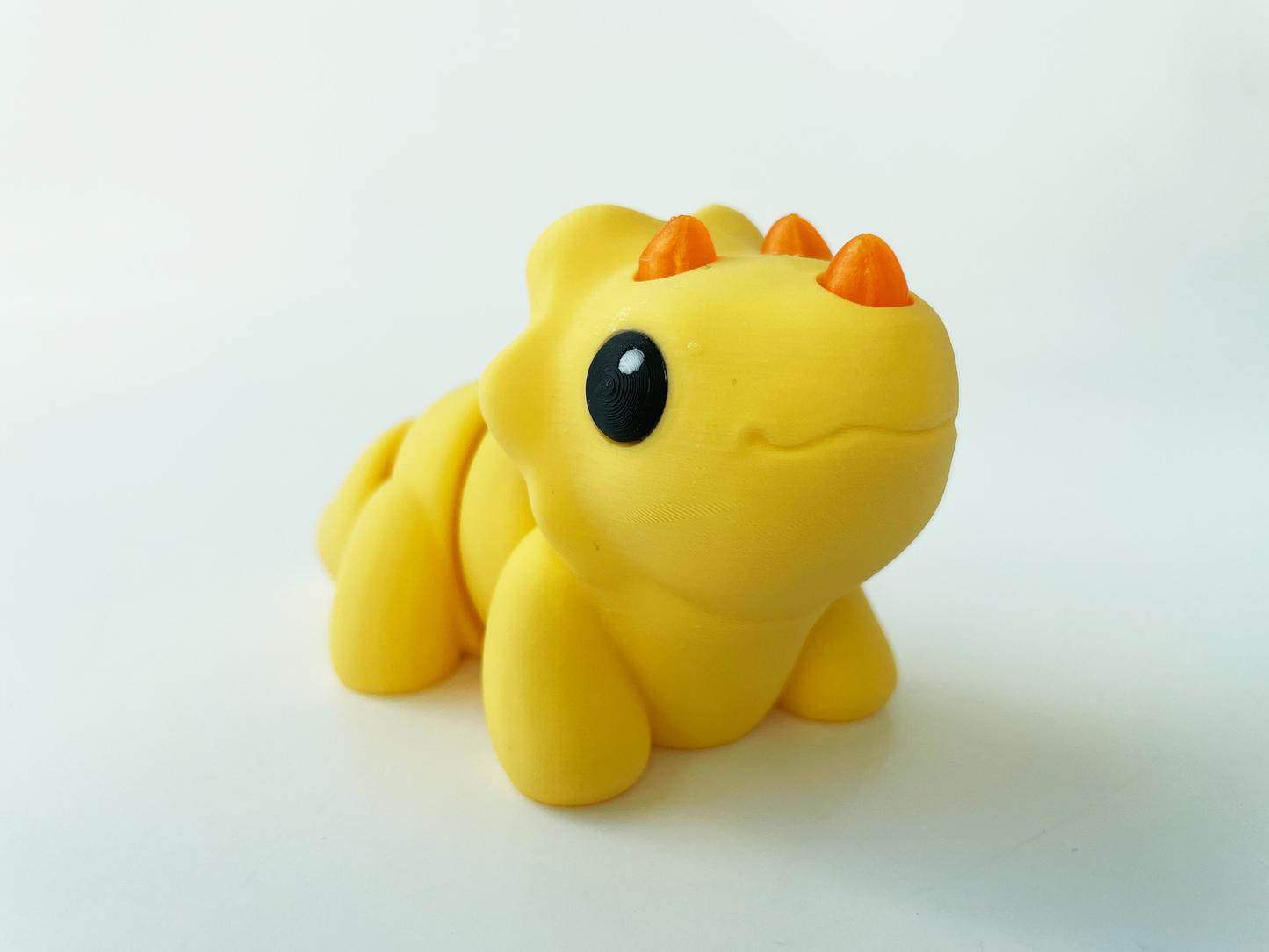 ZOU's Baby Yellow Triceratops Dino Fidget Toy - High-Quality 3D Printed Articulated Dinosaur for Indoor & Outdoor & Stress Relief Play